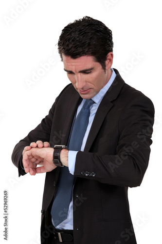 Businessman checking his watch