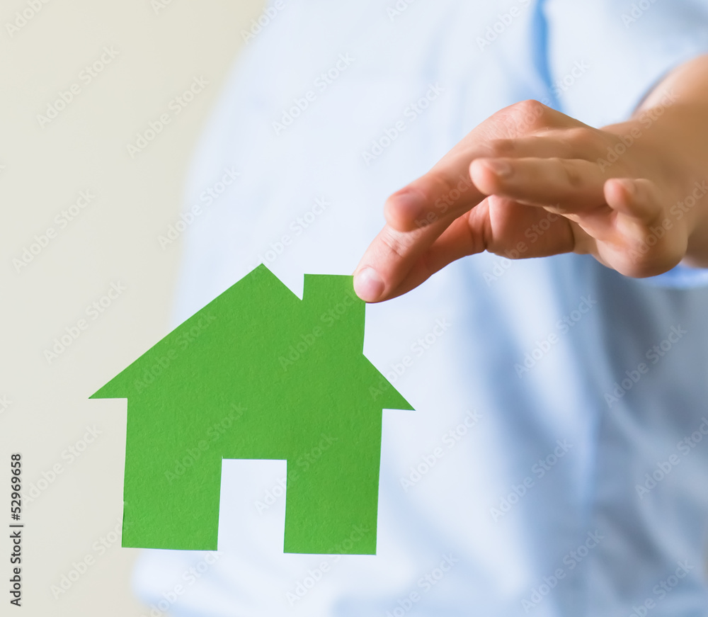 Paper house in the hands Paper house in the hands