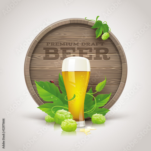 Wooden cask, beer glass, ripe hops and leaves