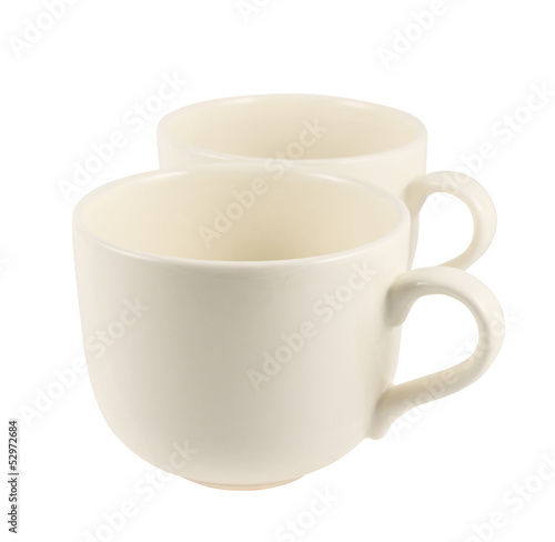 Two ceramic cream colored cups composition