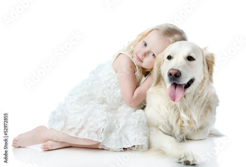 girl embraces a Golden Retriever. looking at camera. isolated