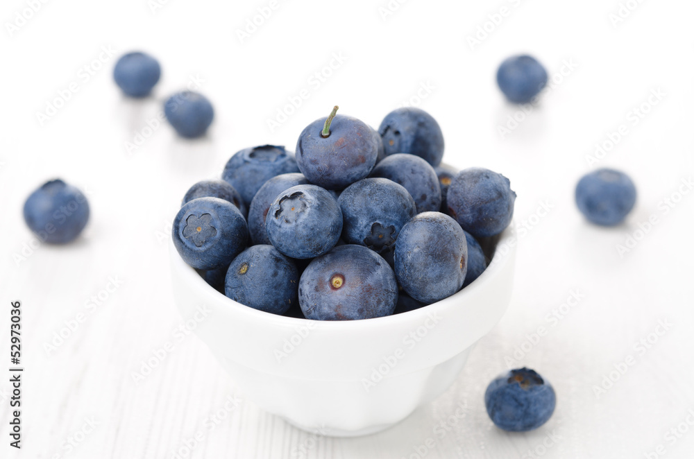 Fresh blueberries in a white bowl, horizontal Fresh blueberries in a white bowl, horizontal