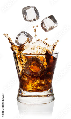 Cola in glass with falling ice cubes on white. With clipping pat