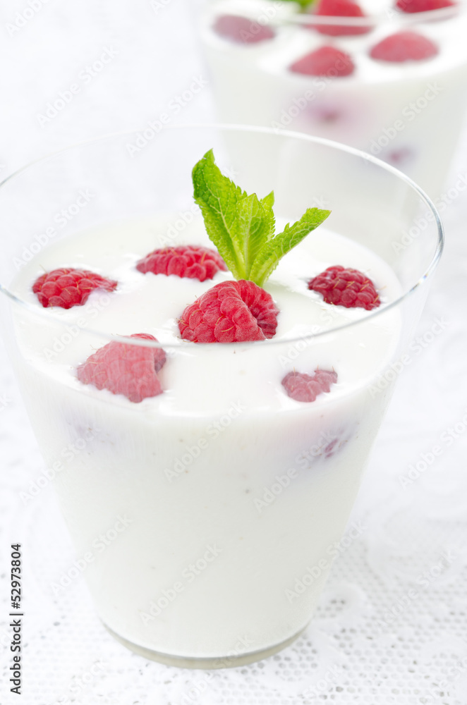 panna cotta with fresh raspberries in glasses closeup panna cotta with fresh raspberries in glasses closeup