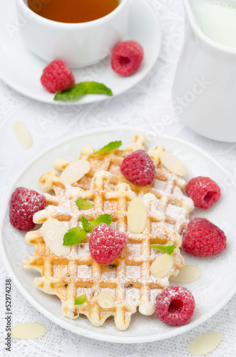 waffles, fresh raspberries and tea for breakfast, top view