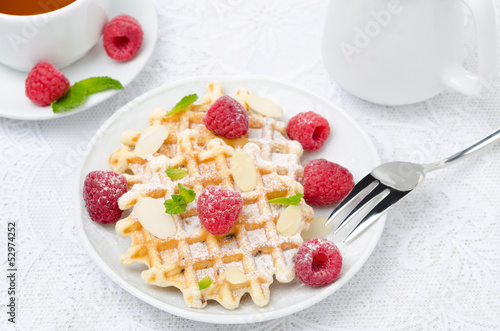 waffles, fresh raspberries and tea for breakfast