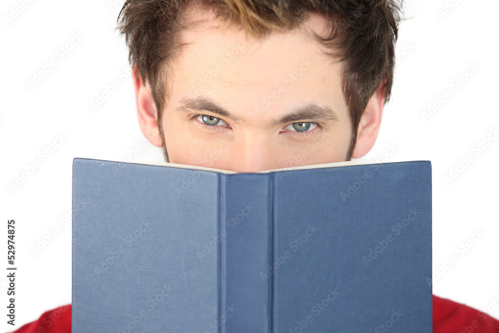 Man covering his face with the bible Man covering his face with the bible