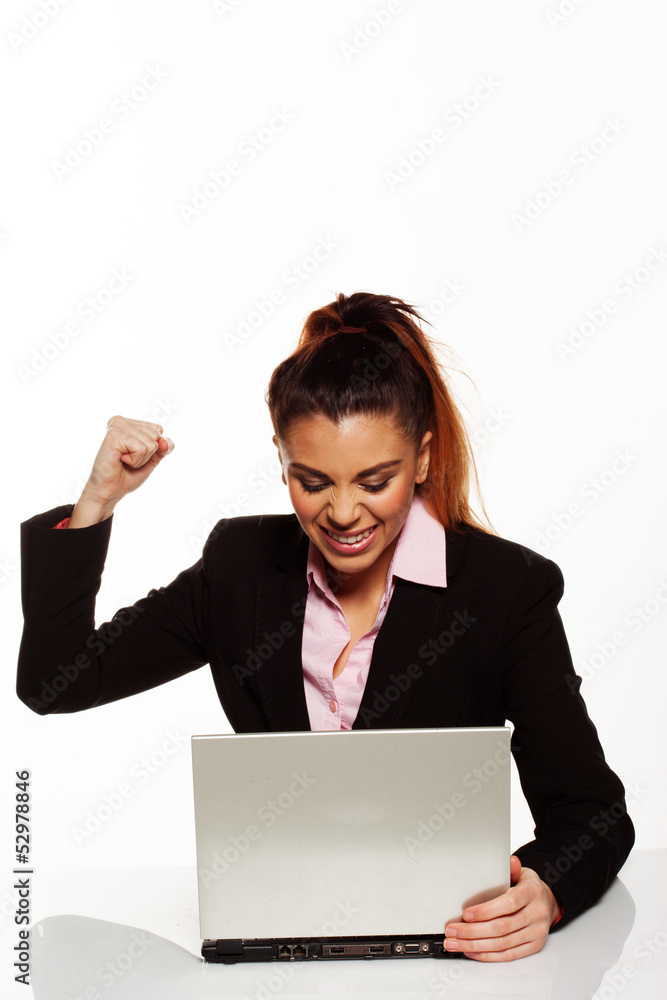 Frustrated woman punching her laptop Frustrated woman punching her laptop