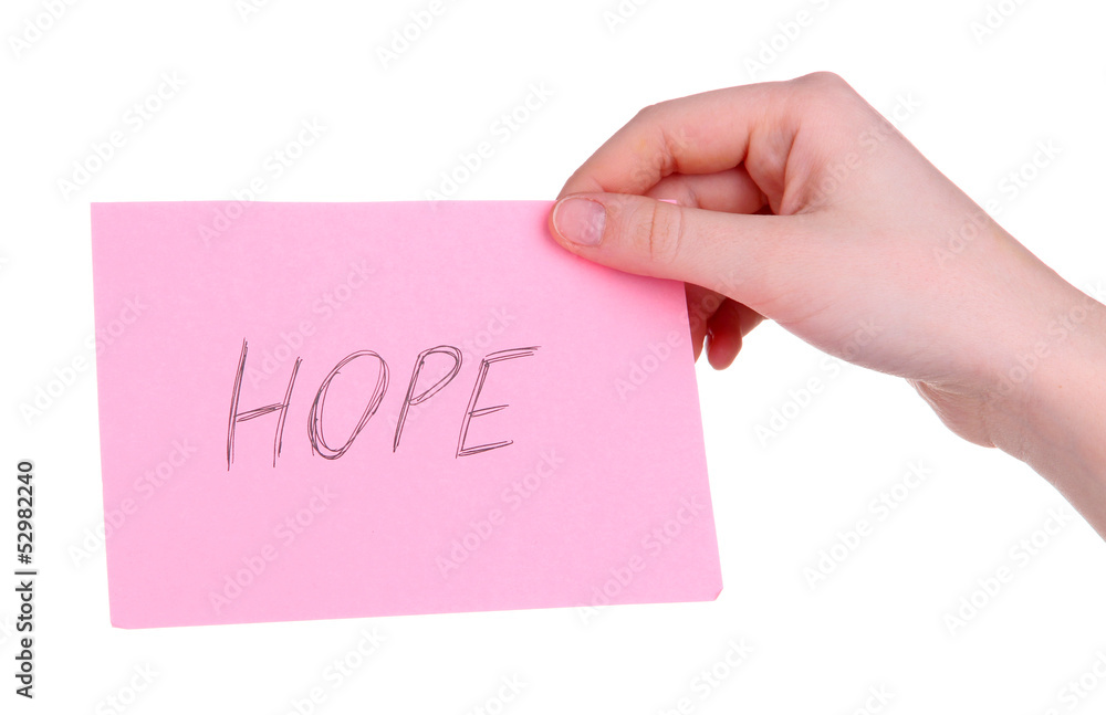 Hope word on piece paper in hand isolated on white Hope word on piece paper in hand isolated on white