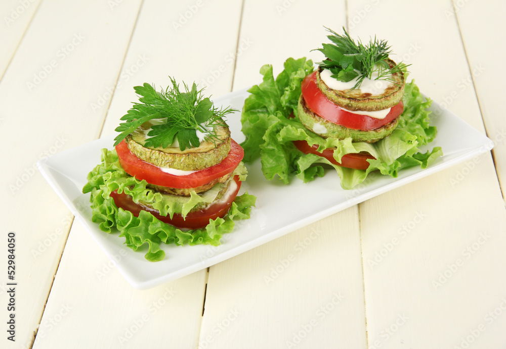Tasty roasted marrow and tomato slices with salad leaves, Tasty roasted marrow and tomato slices with salad leaves,