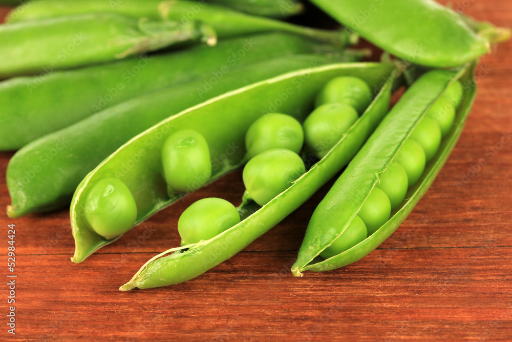 Sweet green peas on wooden background