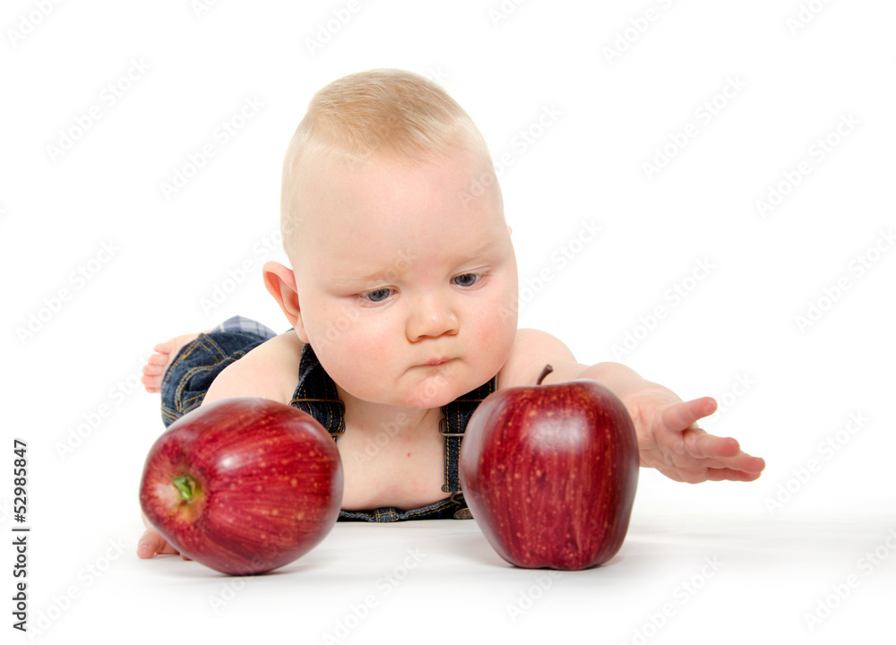 Fototapeta premium Baby boy playing with apples