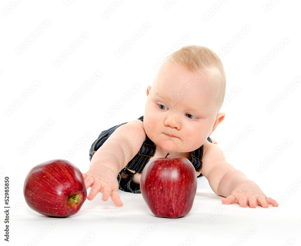 Fototapeta premium Baby boy playing with apples