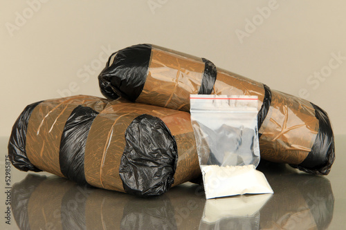 Packages of  narcotics on gray background