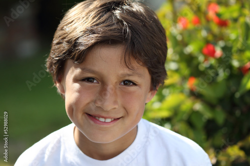 Young smiling boy in the park