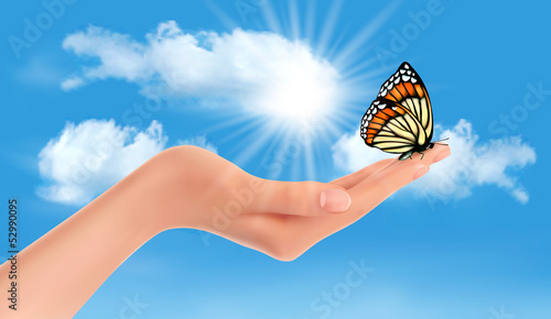 Hand holding a butterfly against a blue sky and sun. Vector