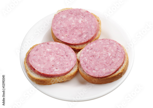 Three sandwiches with sausage