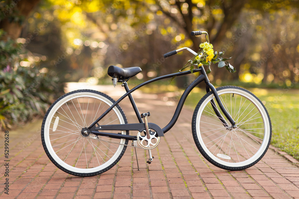 new bicycle at the park with flowers new bicycle at the park with flowers