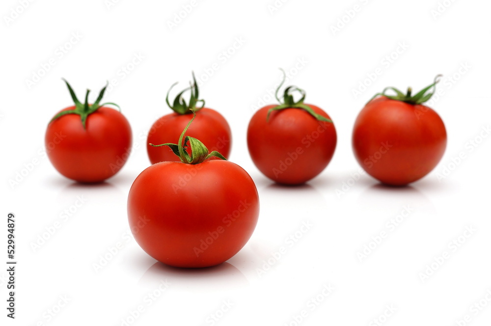 five cherry tomatoes with four in blur five cherry tomatoes with four in blur