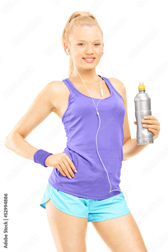 Young female in running outfit posing with a drink bottle Young female in running outfit posing with a drink bottle