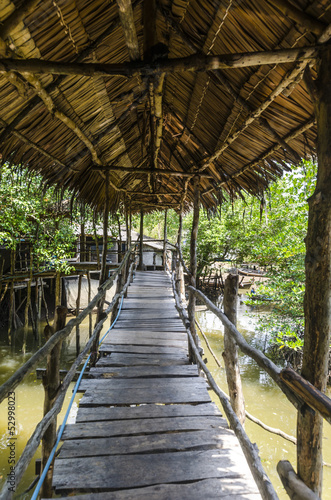 Wooden bridge with a roof in Thailand © rogkoff
