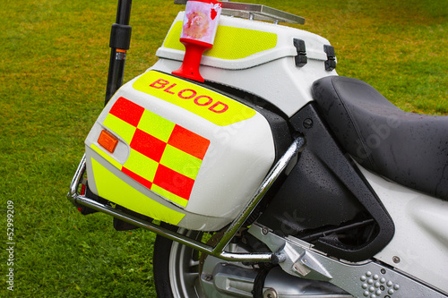 Charity collection tin on blood emergency delivery motorbike