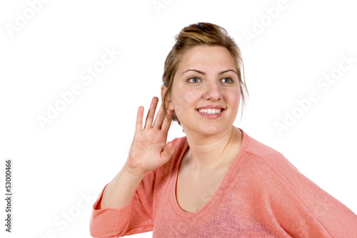 Listening woman with hand at ear