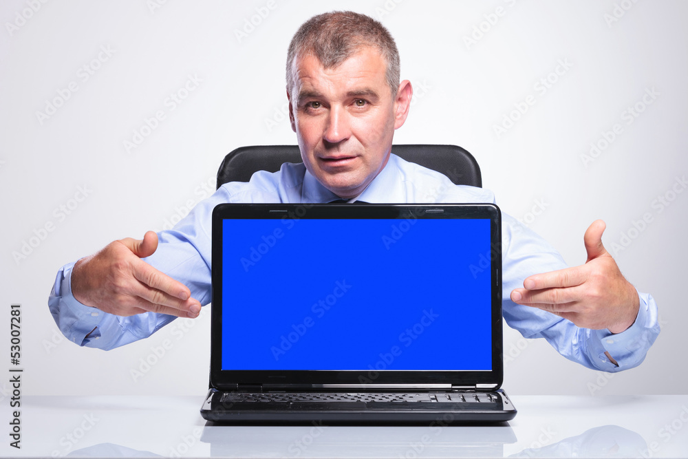 old business man presents his laptop old business man presents his laptop