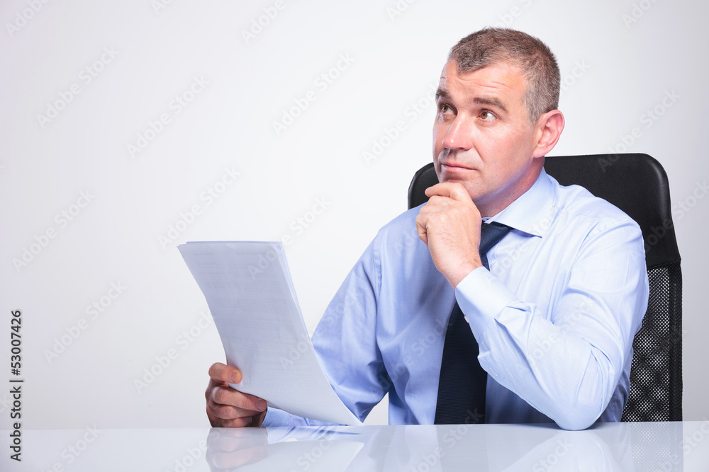 old business man is pensive at office old business man is pensive at office