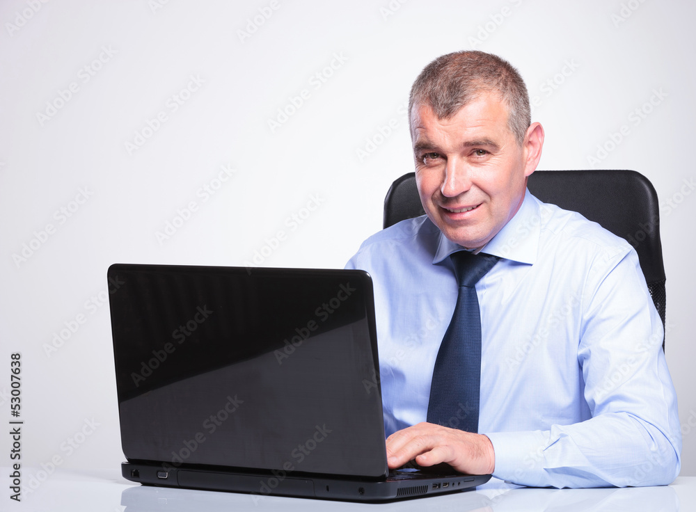 old business man working on laptop