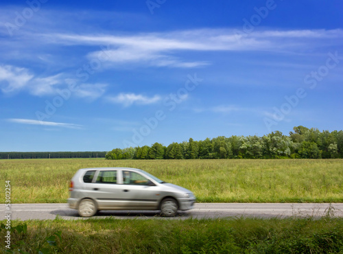 Car Traveling Along a Country Road