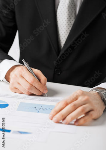 businessman working and signing paper
