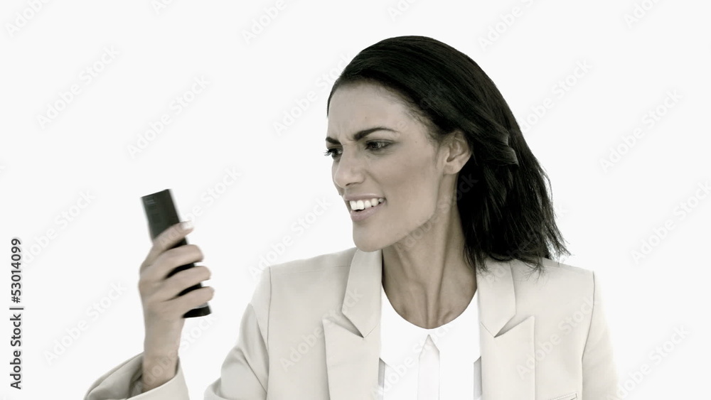 Businesswoman screaming down her mobile phone in black and white Businesswoman screaming down her mobile phone in black and white
