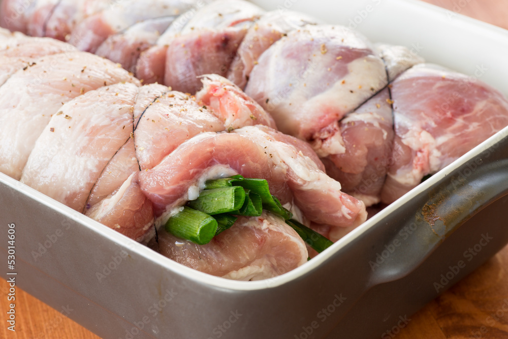 raw meat with green onions twisted to roll