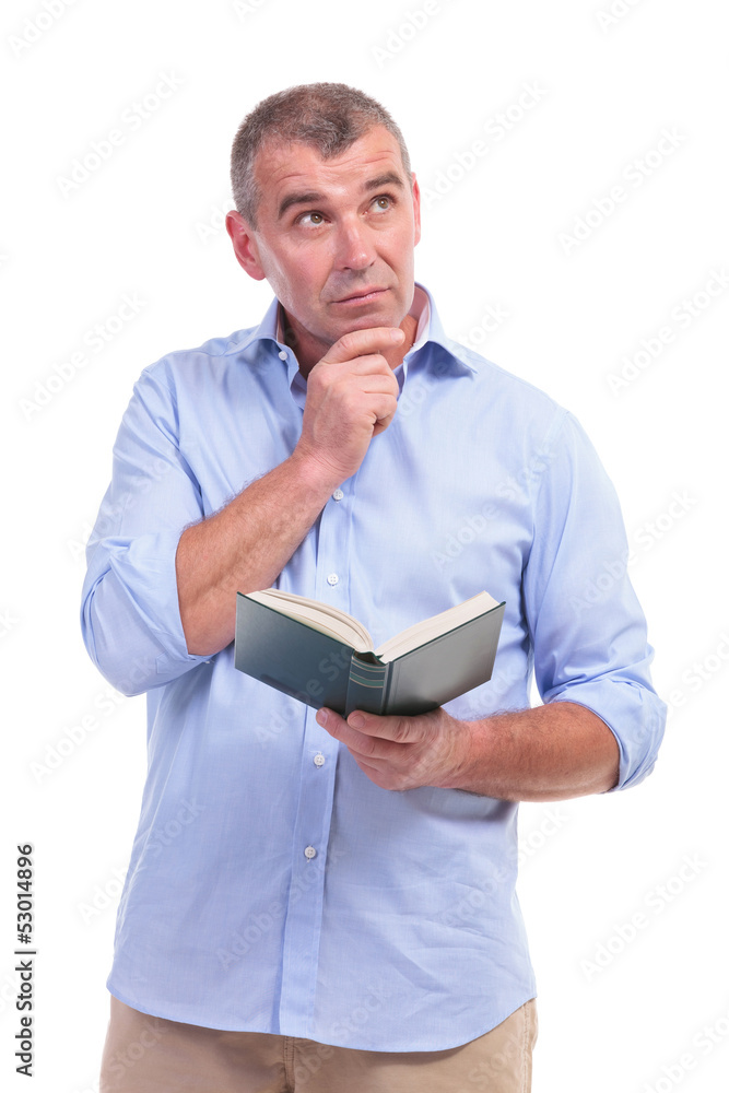 casual middle aged man with book, thinks casual middle aged man with book, thinks