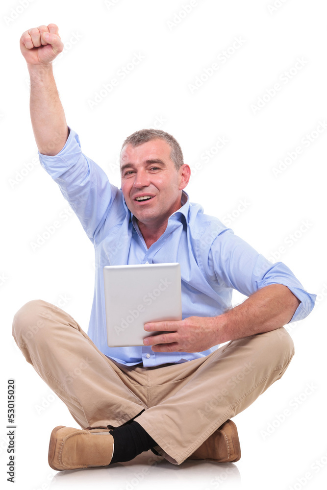 casual old man sits with pad and cheers casual old man sits with pad and cheers