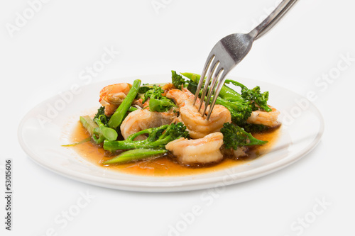 Prawns with broccoli fried sauce on white dish