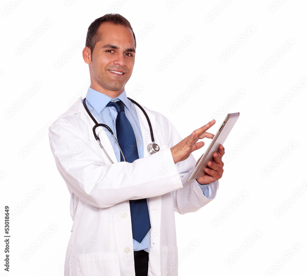 Smiling medical doctor using his tablet pc Smiling medical doctor using his tablet pc