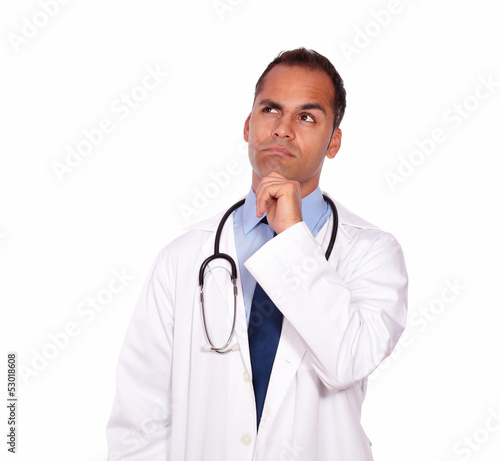 Pensive medical doctor looking up copyspace