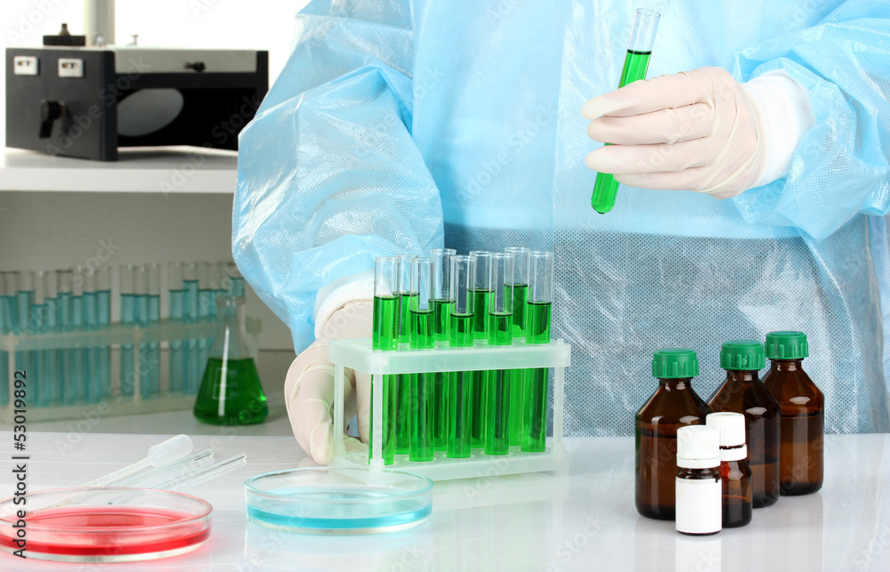 Scientist conducting research in laboratory close up Scientist conducting research in laboratory close up