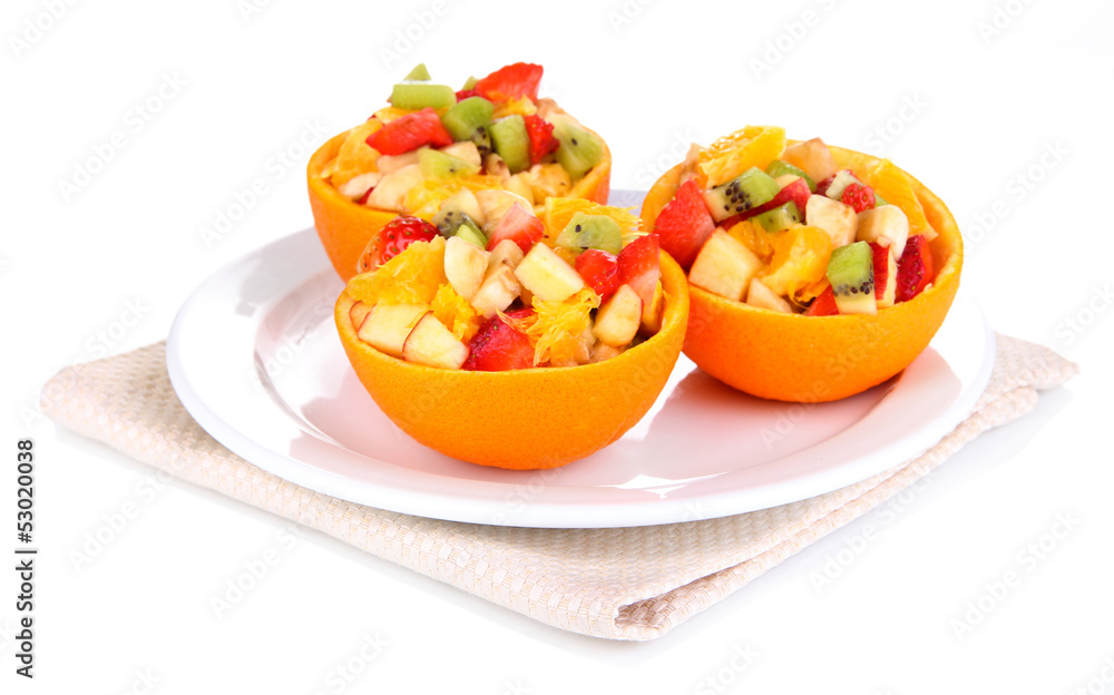Fruit salad in hollowed-out orange isolated on white Fruit salad in hollowed-out orange isolated on white