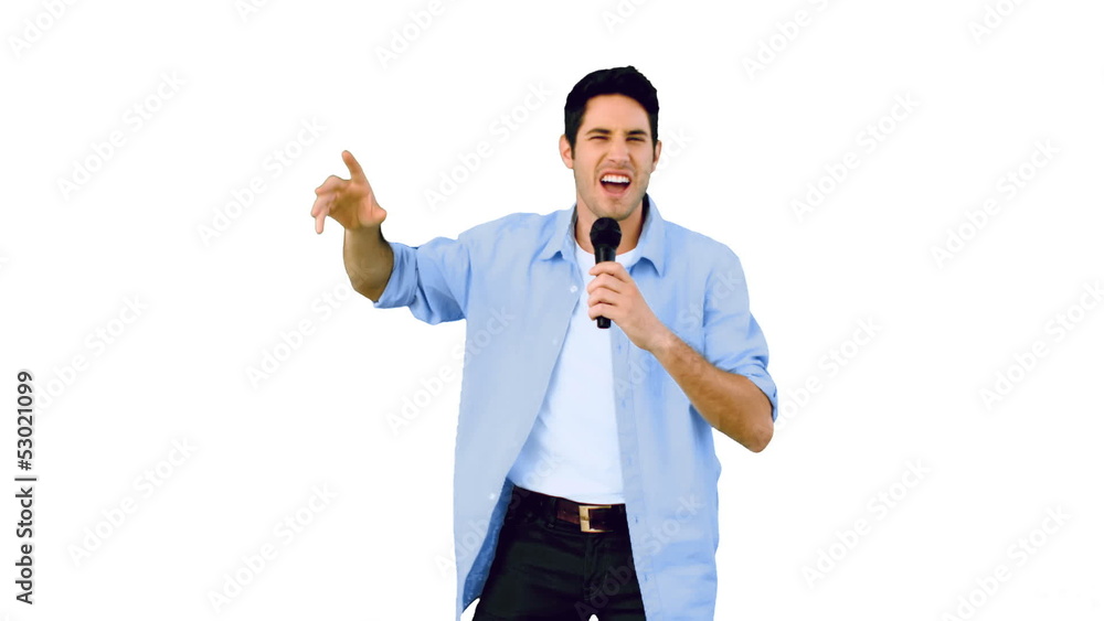 Man singing into microphone and dancing Man singing into microphone and dancing