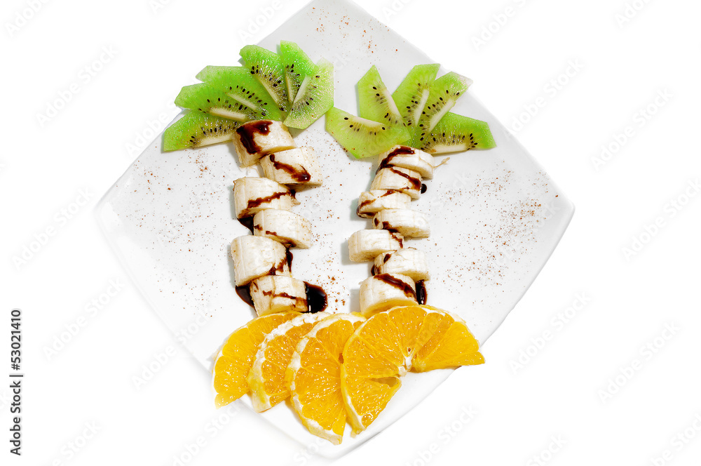 Creative  dessert  for child with banana, kiwi, orange.