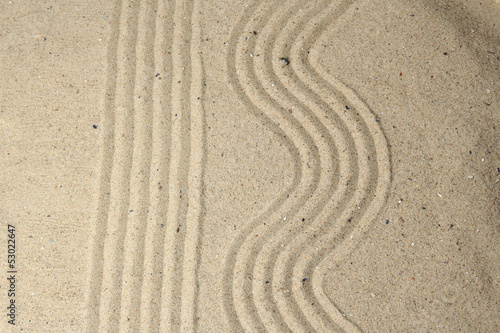 Zen garden with raked sand close up