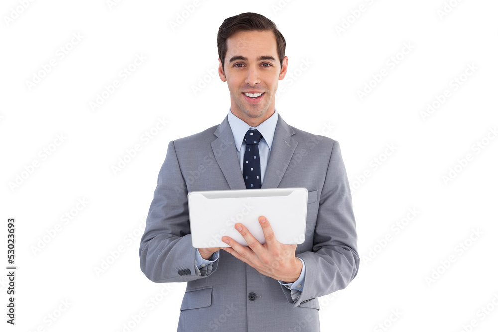 Smiling businessman holding a tablet computer Smiling businessman holding a tablet computer
