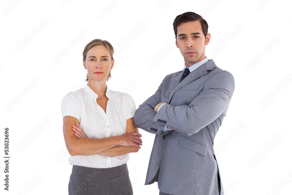 Serious co workers standing together Serious co workers standing together