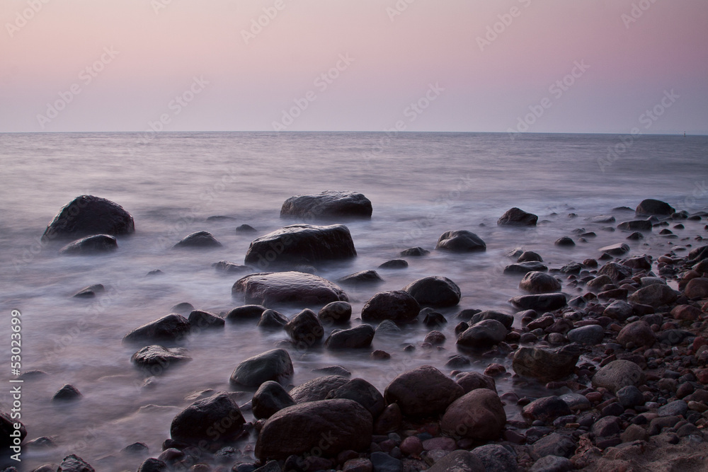 morning at the sea. stones in the water morning at the sea. stones in the water