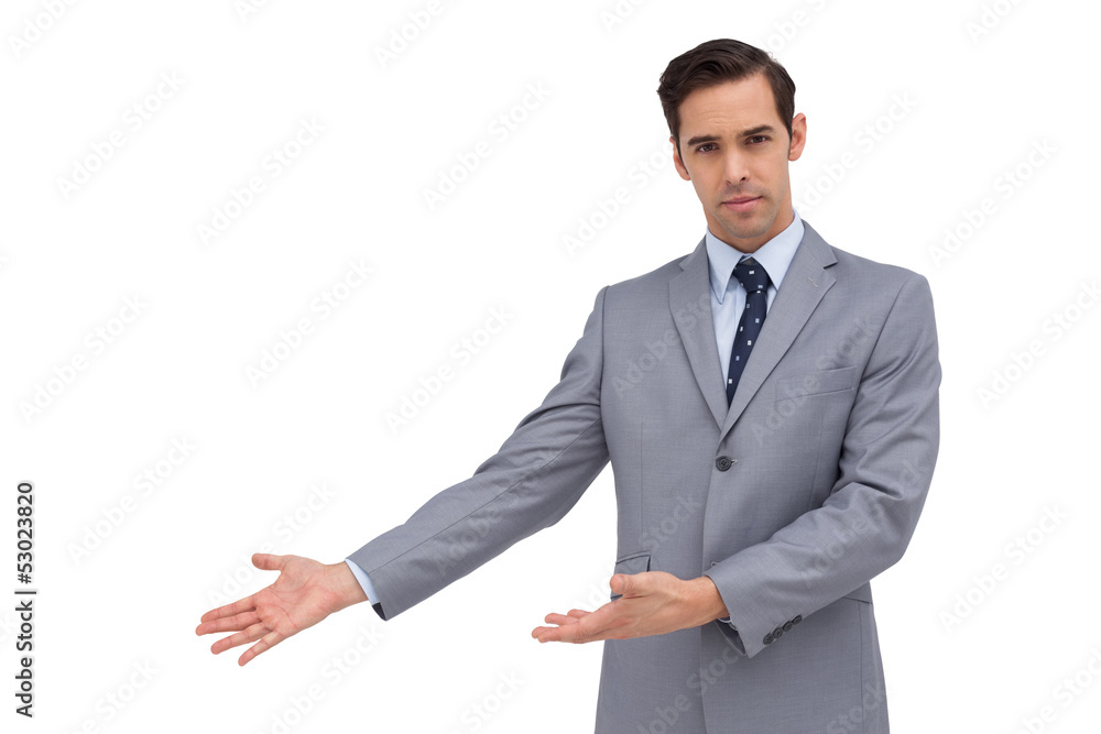 Serious businessman giving a presentation with his hands Serious businessman giving a presentation with his hands