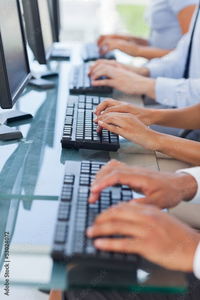Business people working on computers Business people working on computers