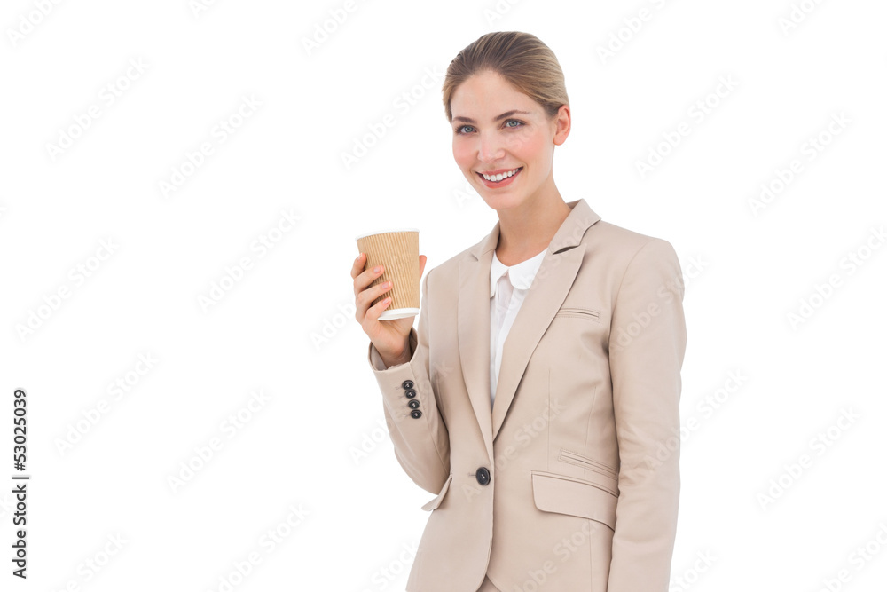 Smiling businesswoman holding a coffee cup Smiling businesswoman holding a coffee cup